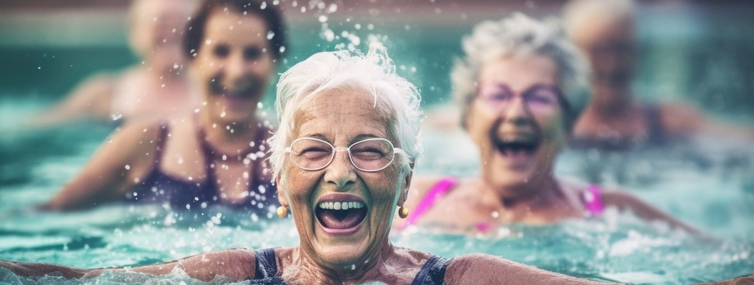 A group of elderly women having a fun and energetic water aerobics session in a pool, elderly happy people, old age, bokeh Generative AI
