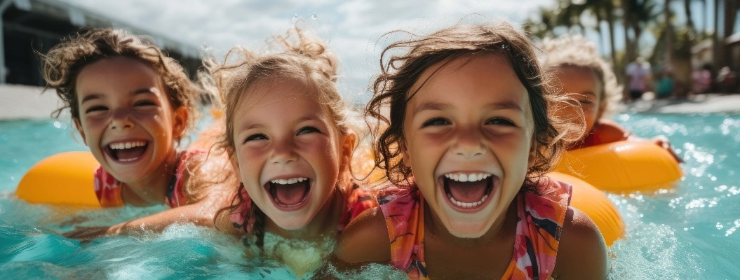 Happy kids have fun in the outdoor water park