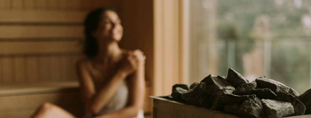 Young woman relaxing in the sauna